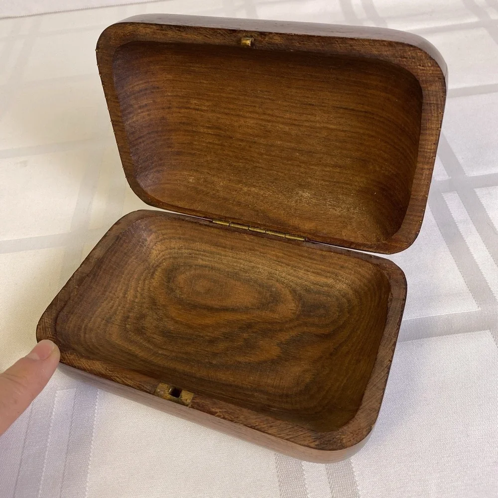 Hand carved 2 piece wood box with metal hinge, hook and metal ribs on lid